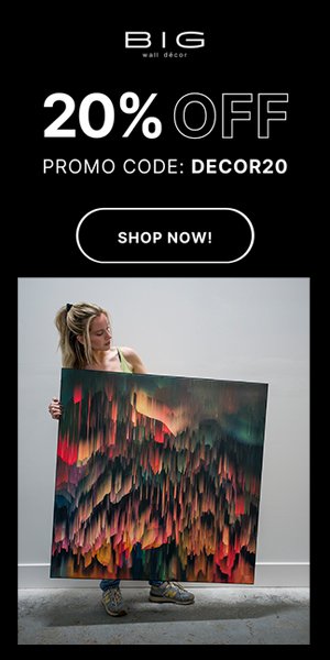 Person holding a large colorful wall art piece
