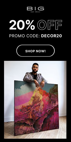 Person holding large wall art with bold colors